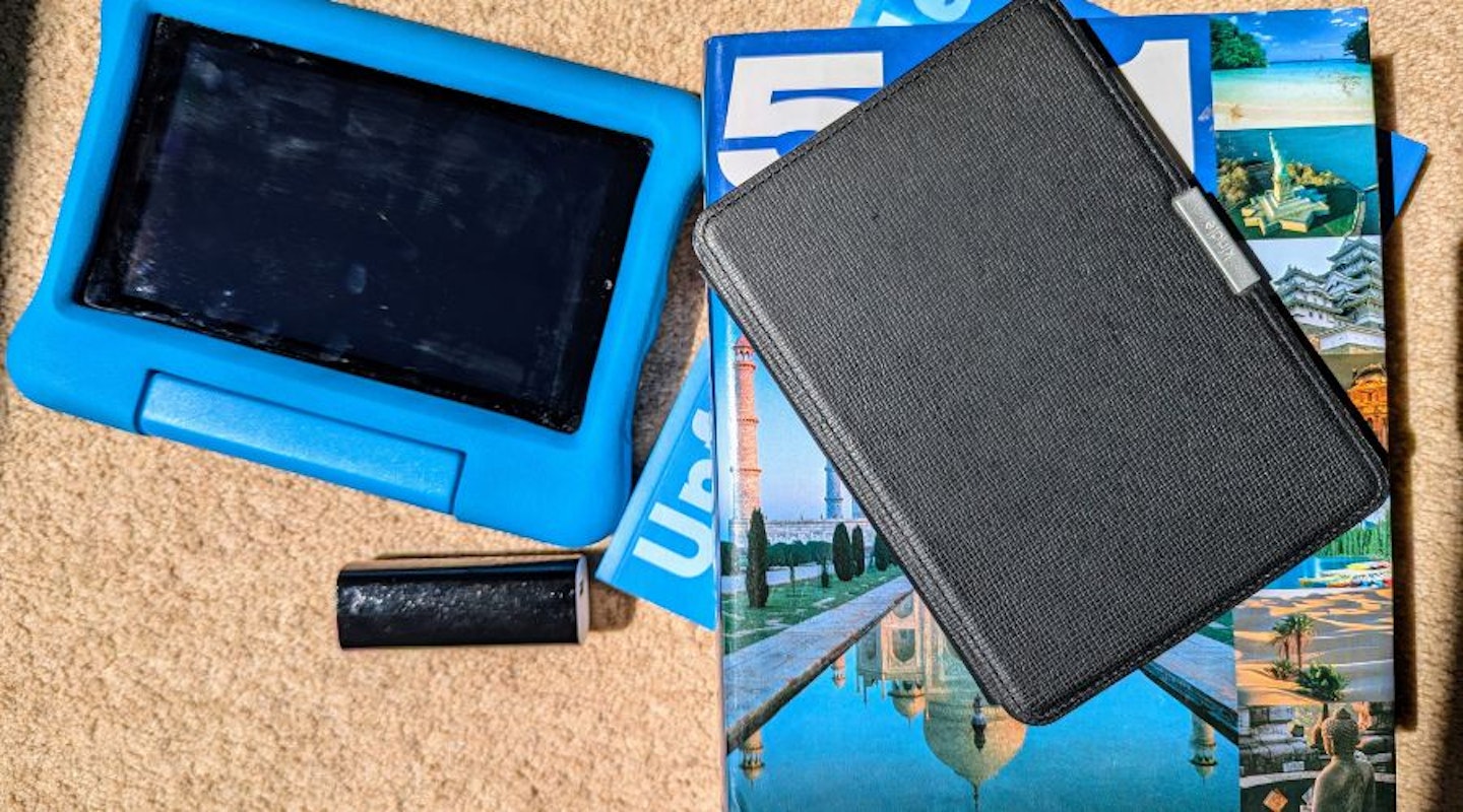 An Amazon Kindle Kids tablet, Amazon Kindle e-reader and power bank