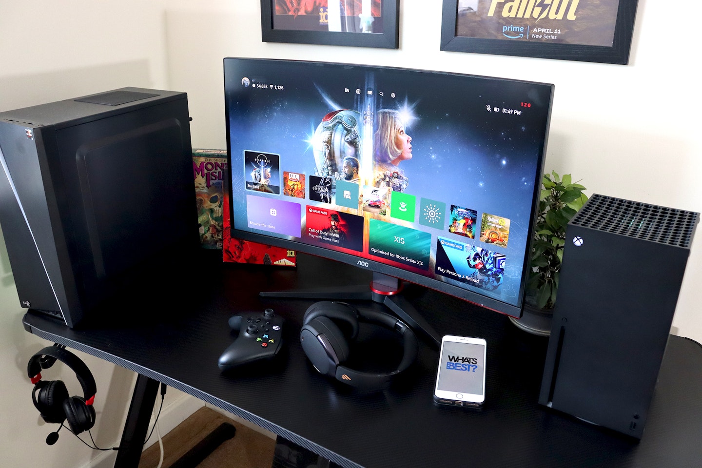 AOC Gaming CQ27G2SE monitor on a desk with an Xbox and a pc