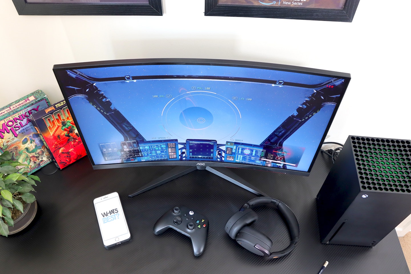 AOC Gaming CQ27G2SE monitor on a desk with an Xbox