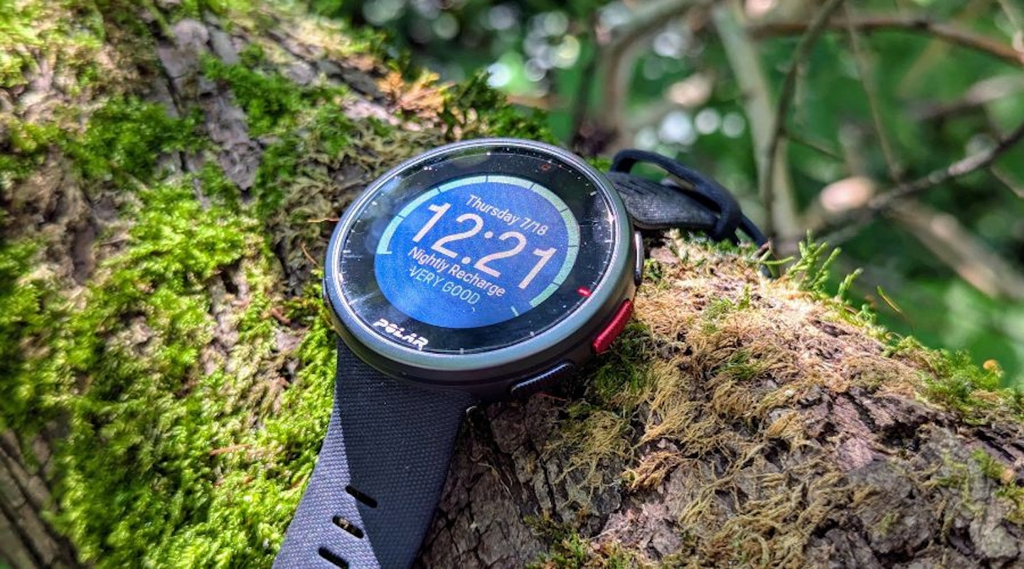 Polar Vantage V2 watch on mossy tree branch