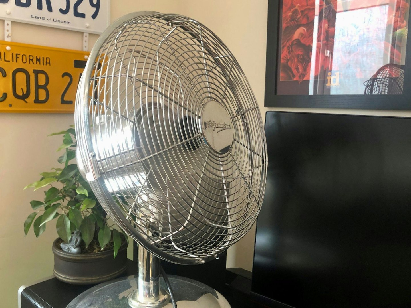 A large metal desk fan