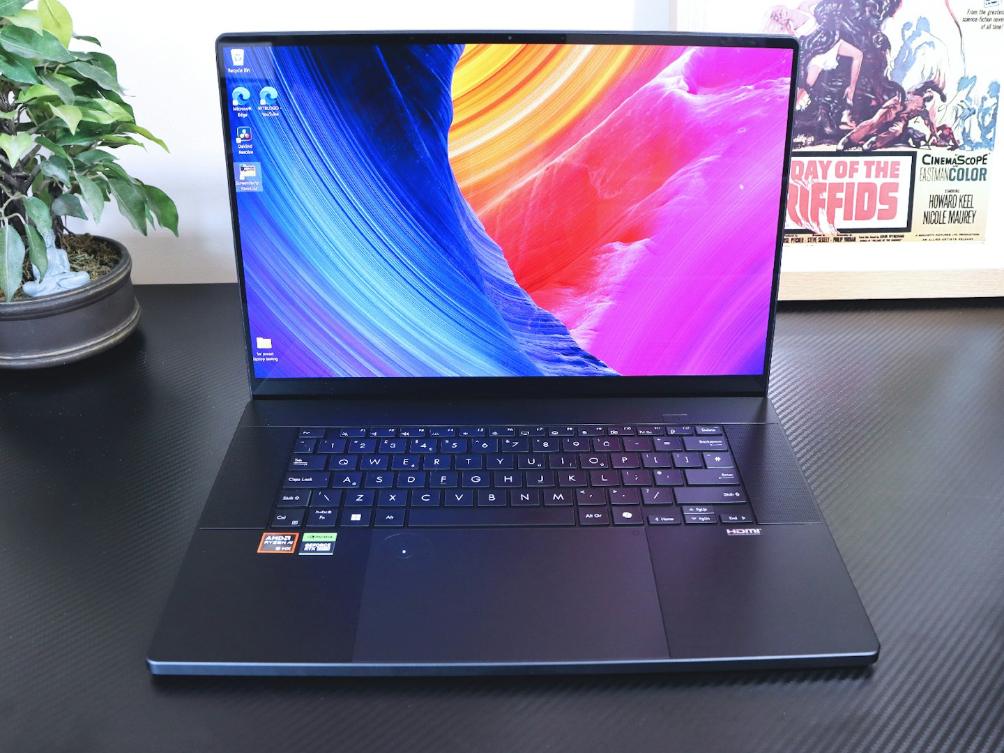 ASUS ProArt P16 laptop on a desk with the Windows 11 desktop