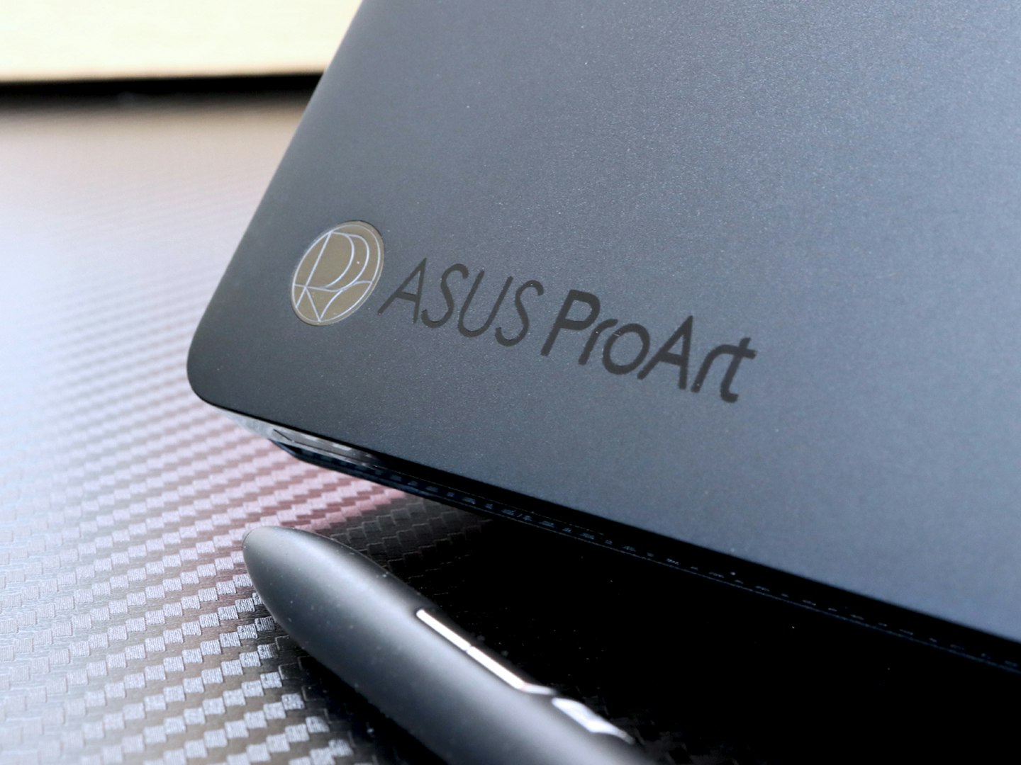 ASUS ProArt P16 laptop logo and stylus