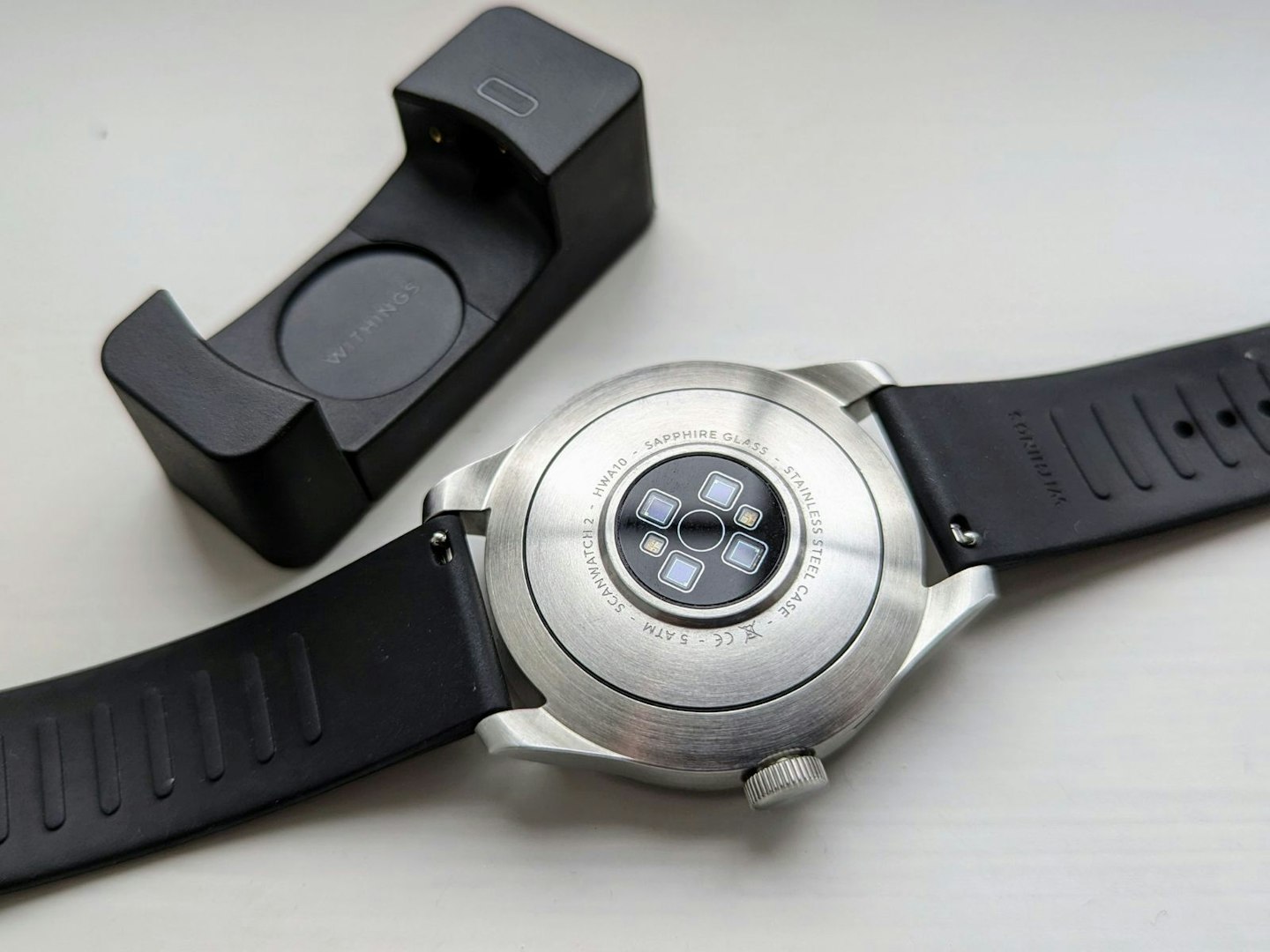 Charging cradle and rear of the Withings ScanWatch 2