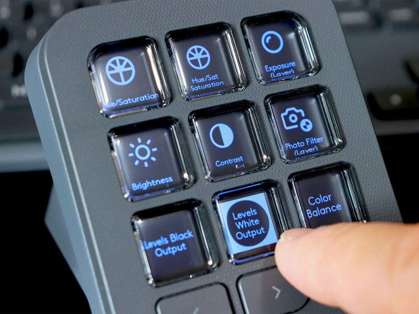 Logitech MX Creative Console keypad with photoshop adjustment buttons