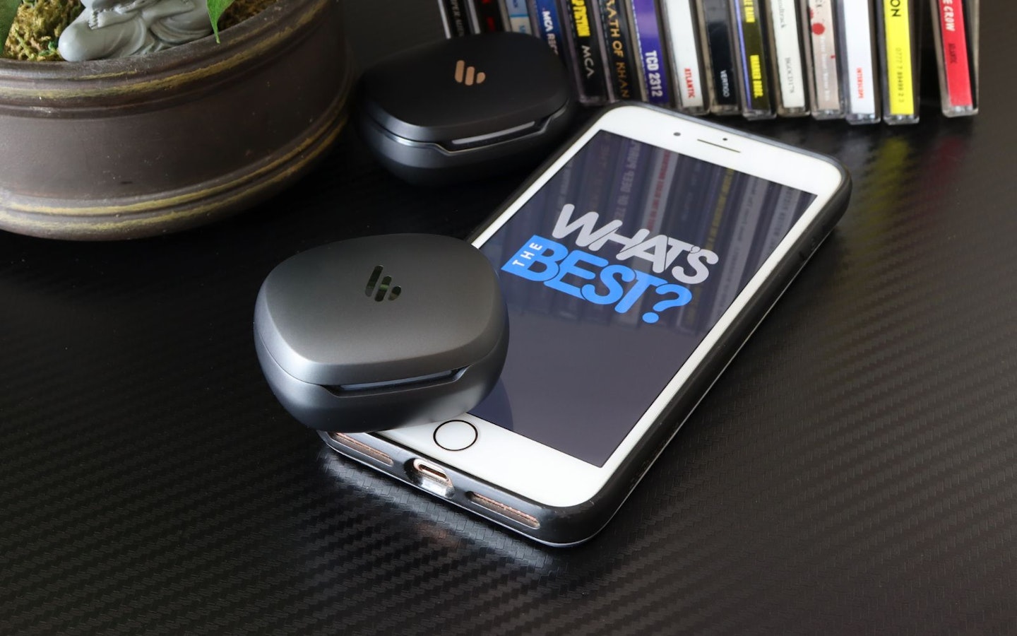 Edifier NeoBuds Planar earbuds and NeoBuds Pro 2 cases next to iphone with WTB logo