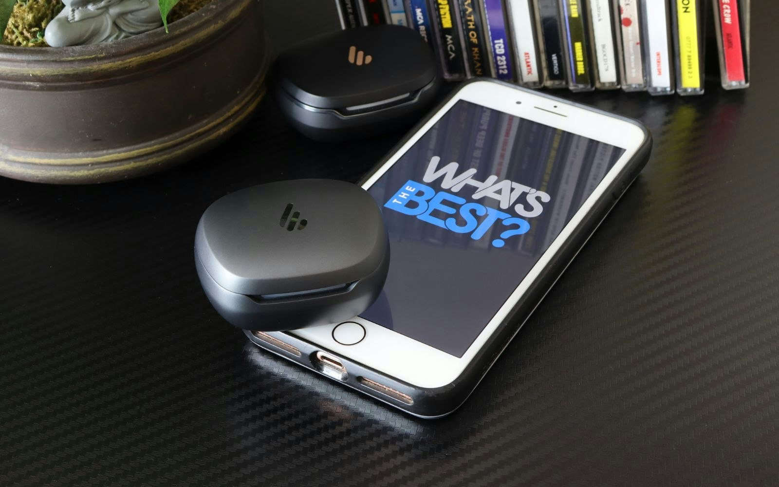 Edifier NeoBuds Planar earbuds and NeoBuds Pro 2 cases next to iphone with WTB logo