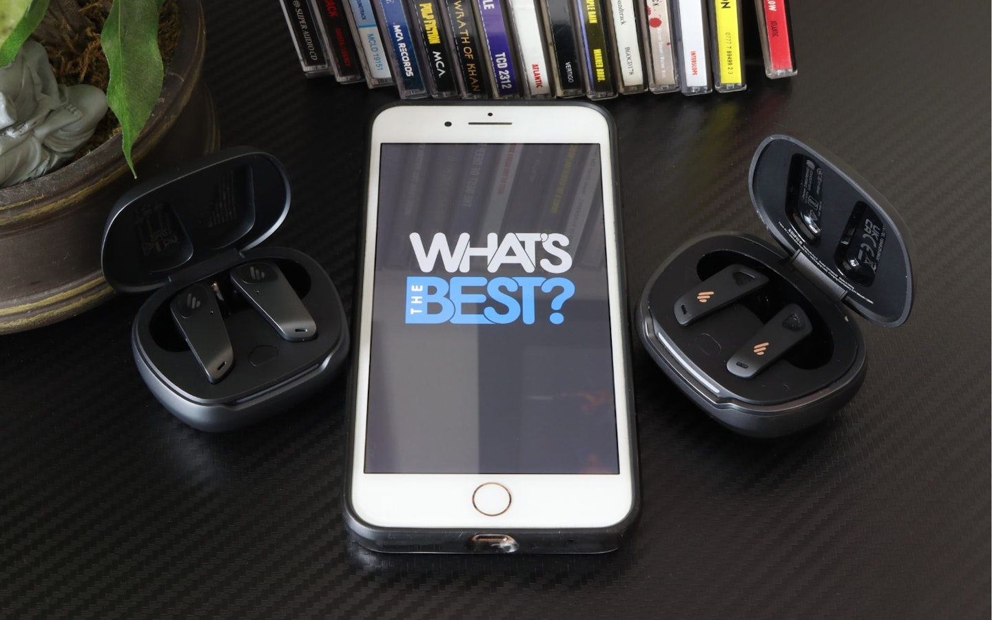Edifier NeoBuds Planar earbuds and NeoBuds Pro 2 cases next to iphone with WTB logo