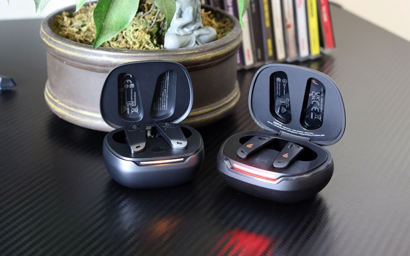 Edifier NeoBuds Planar earbuds and NeoBuds Pro 2 cases on a desk