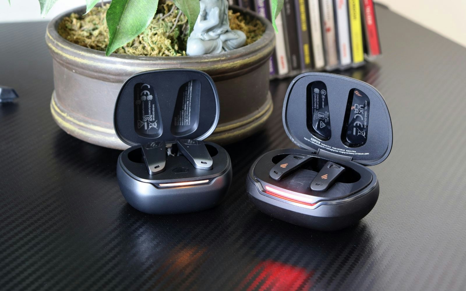 Edifier NeoBuds Planar earbuds and NeoBuds Pro 2 cases on a desk