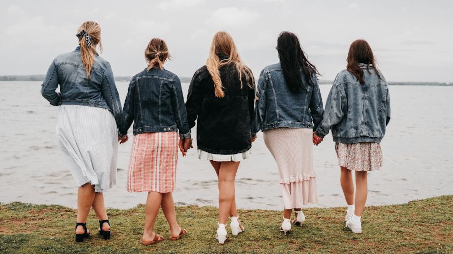 Ladies wearing cotton jackets on a cold summer's day by the sea