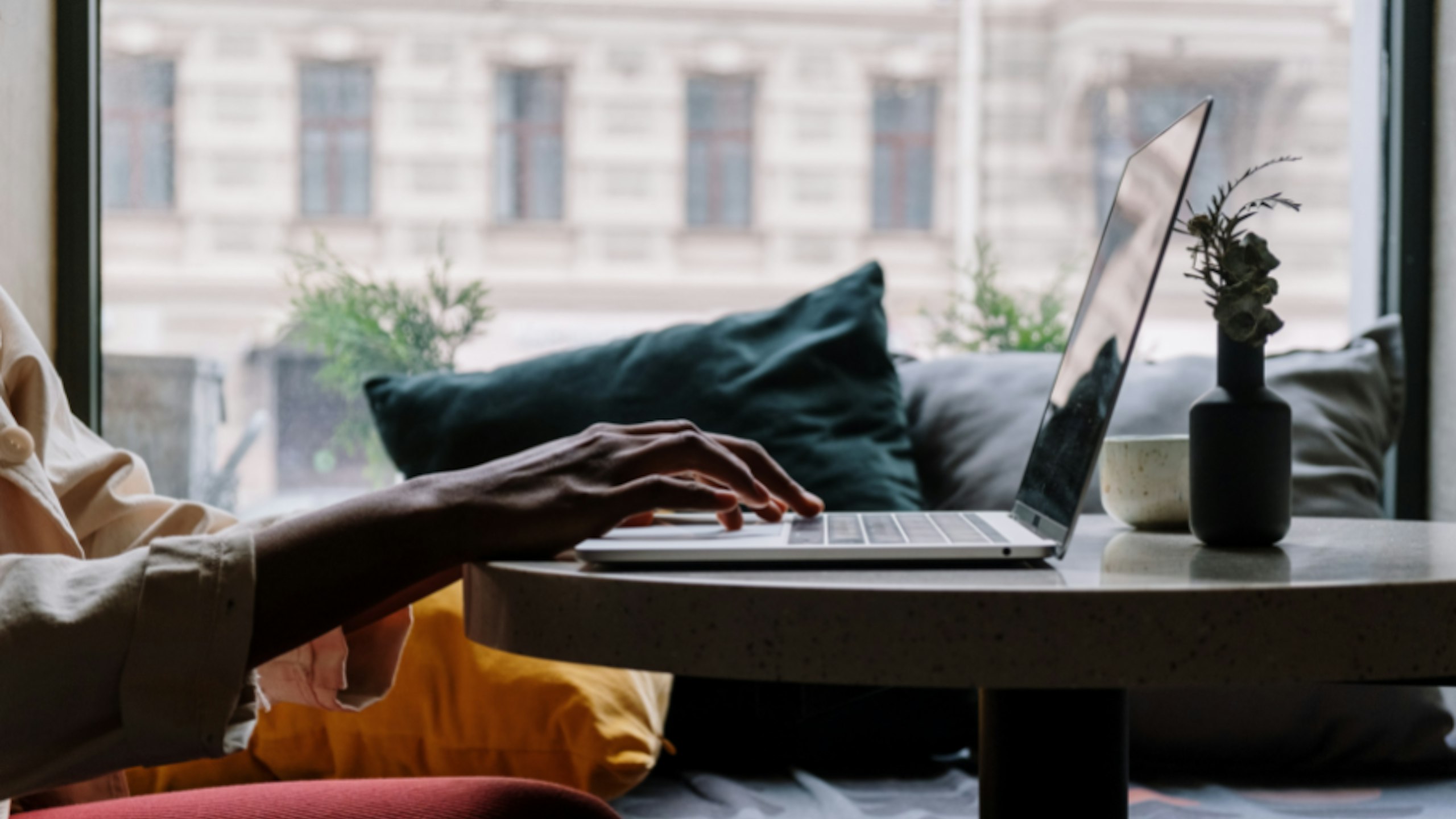 A person using a budget laptop