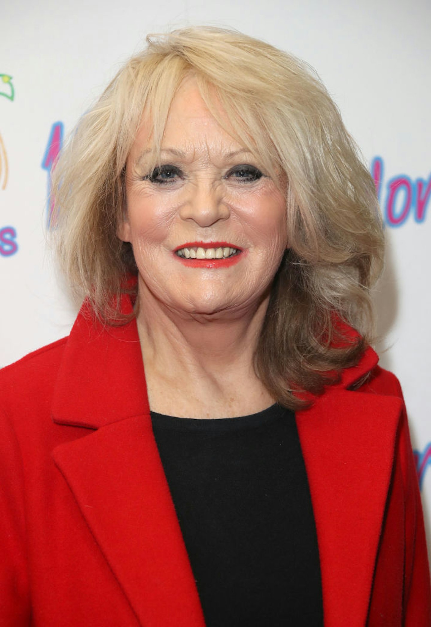 Sherrie Hewson in a red blazer and a short bob