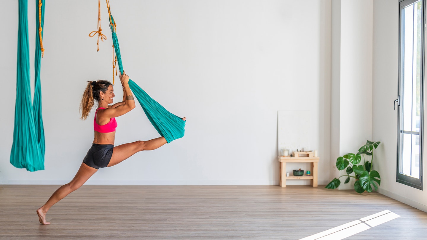 The Best Aerial Yoga Poses to Relieve Back Pain