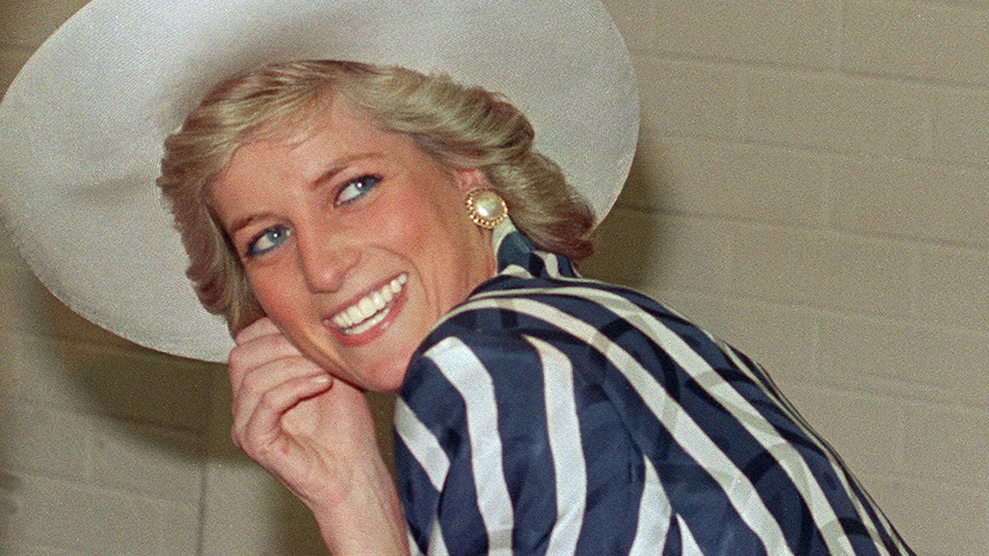 Princess Diana smiling in hat