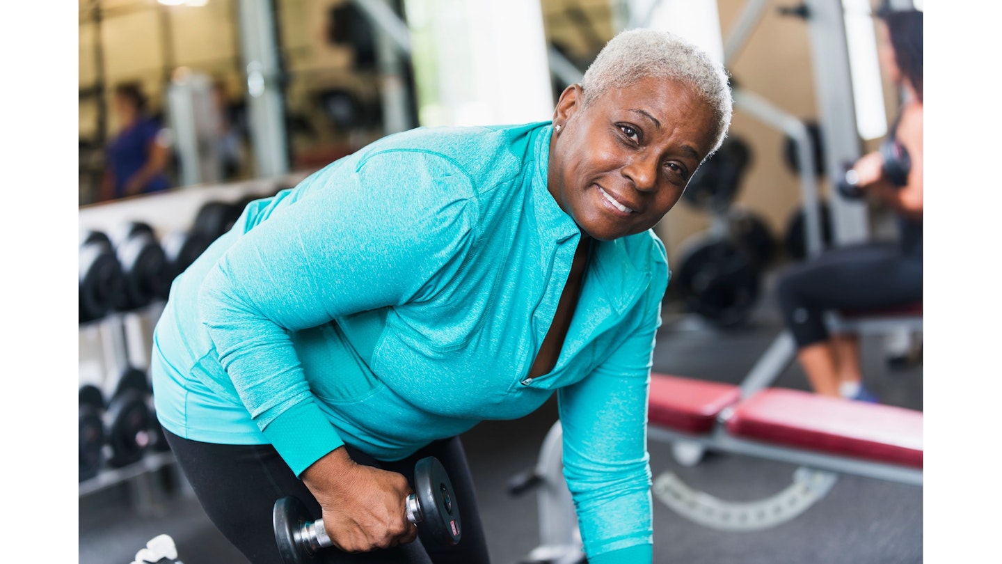 Woman performing a dumbbell row