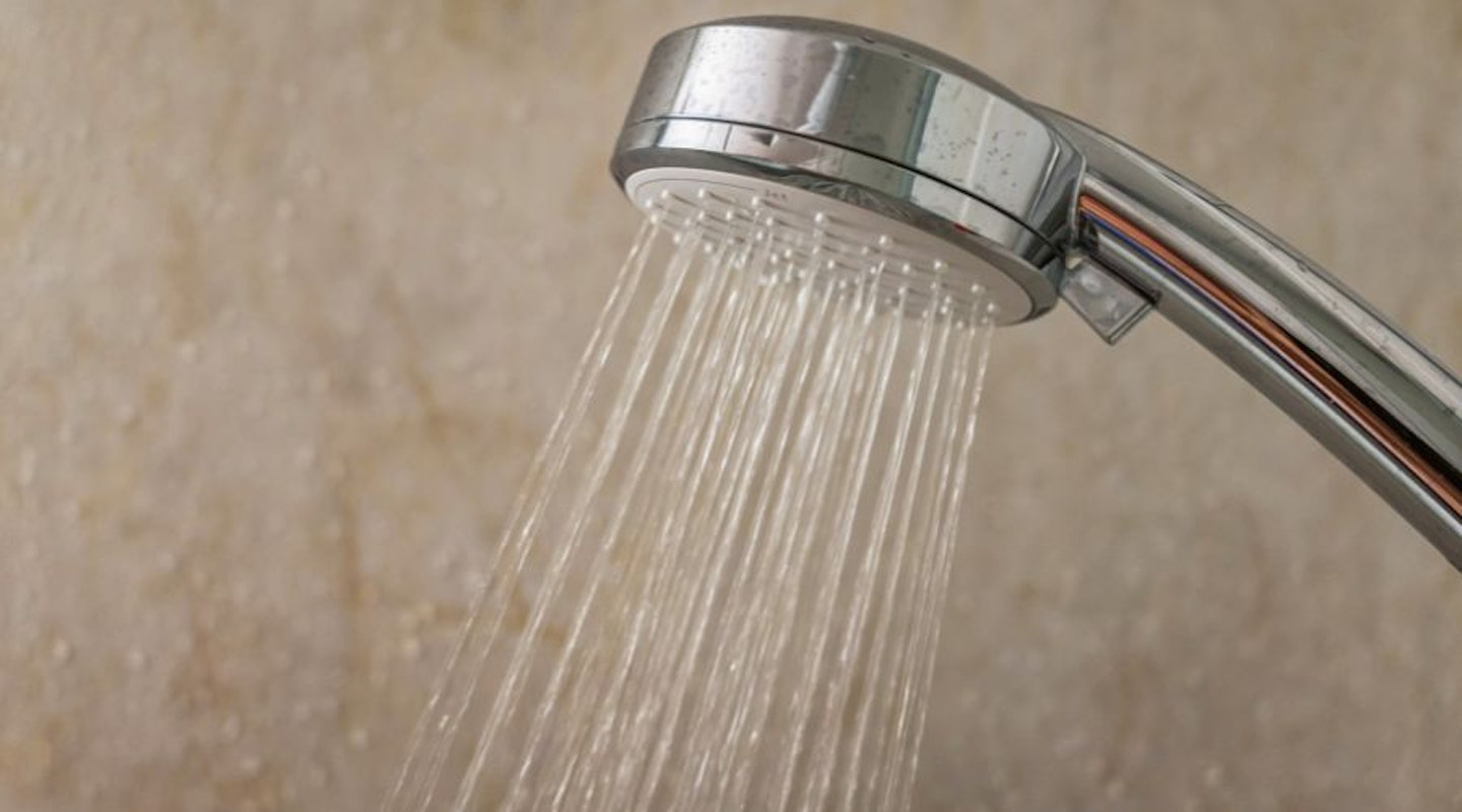 A close up of a water-saving showerhead