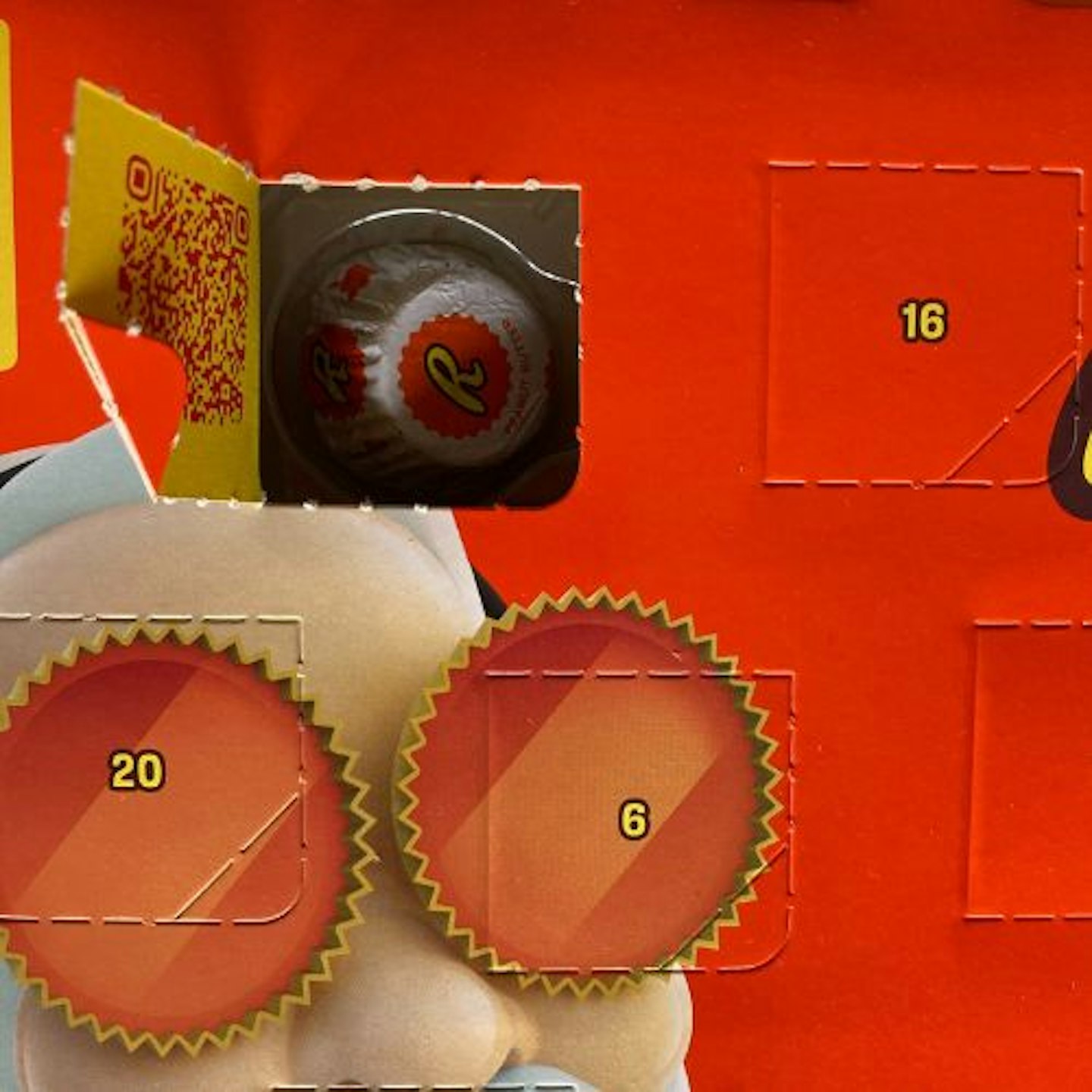 Reese's Advent Calendar, open with a Reeses Miniature Peanut Butter Cup