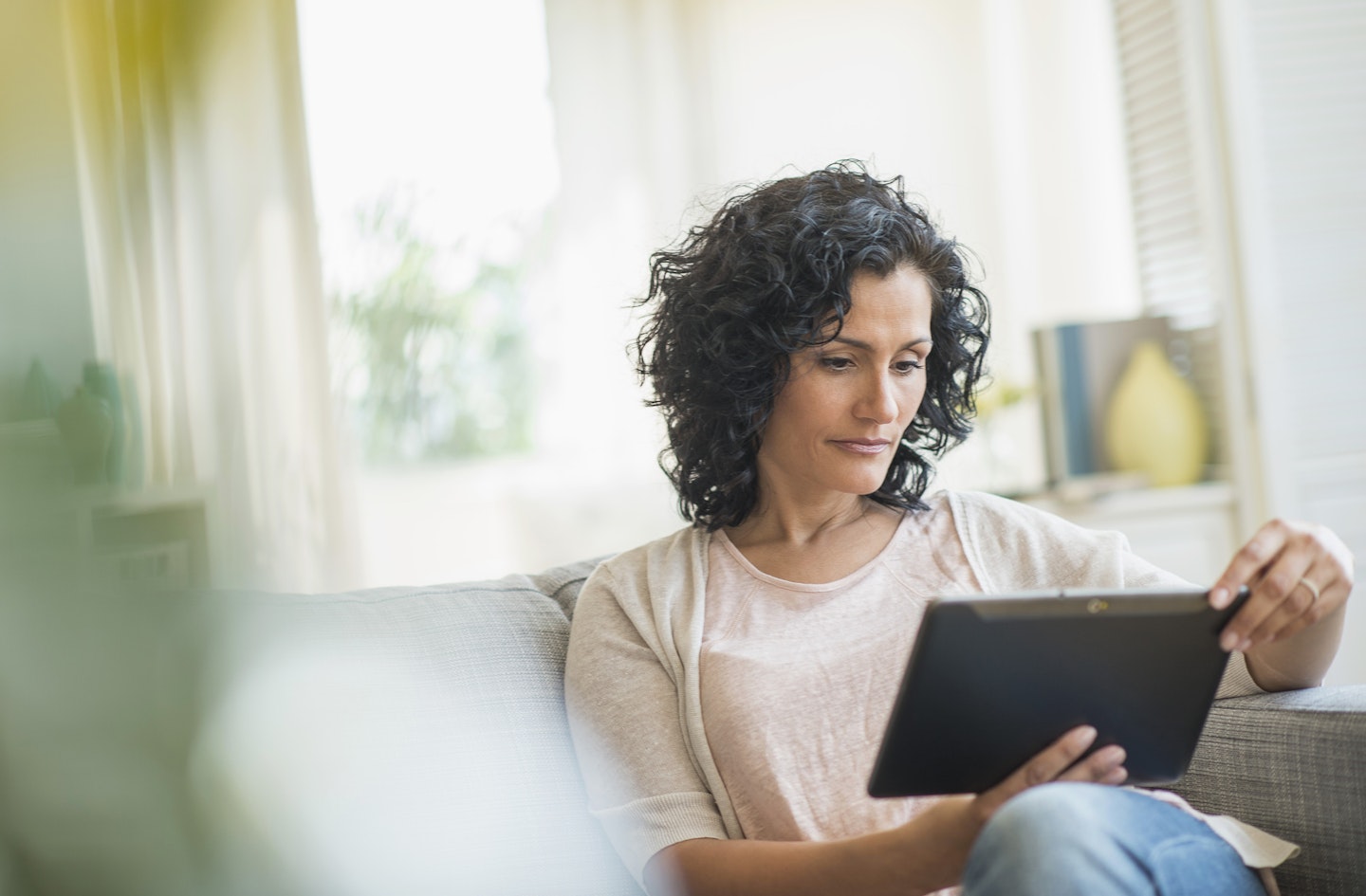 women sat on tablet