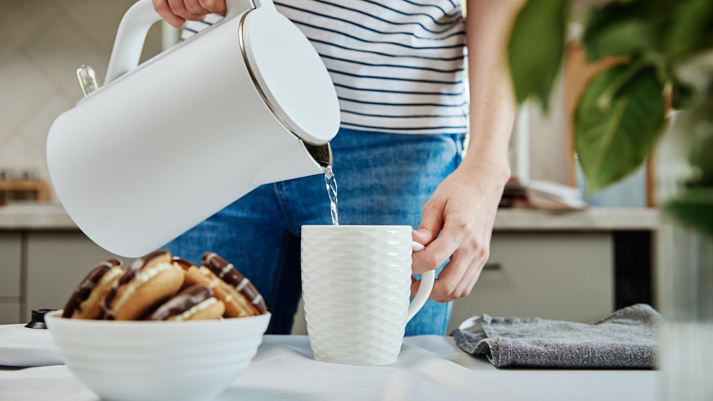 Woman using kettle