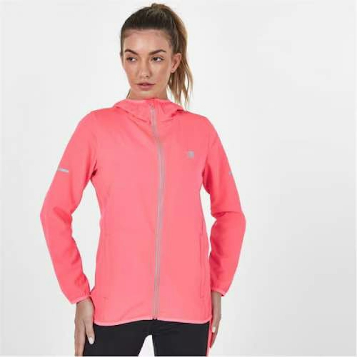 Lady with a ponytail wearing a pink zip up running jacket 