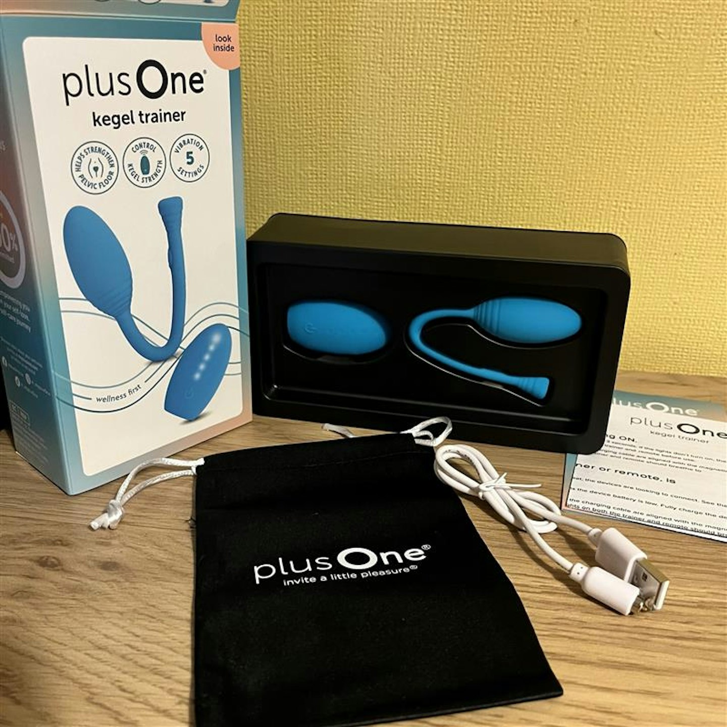 Plus one pelvic floor trainer box contents - divide, charging cable and pouch 