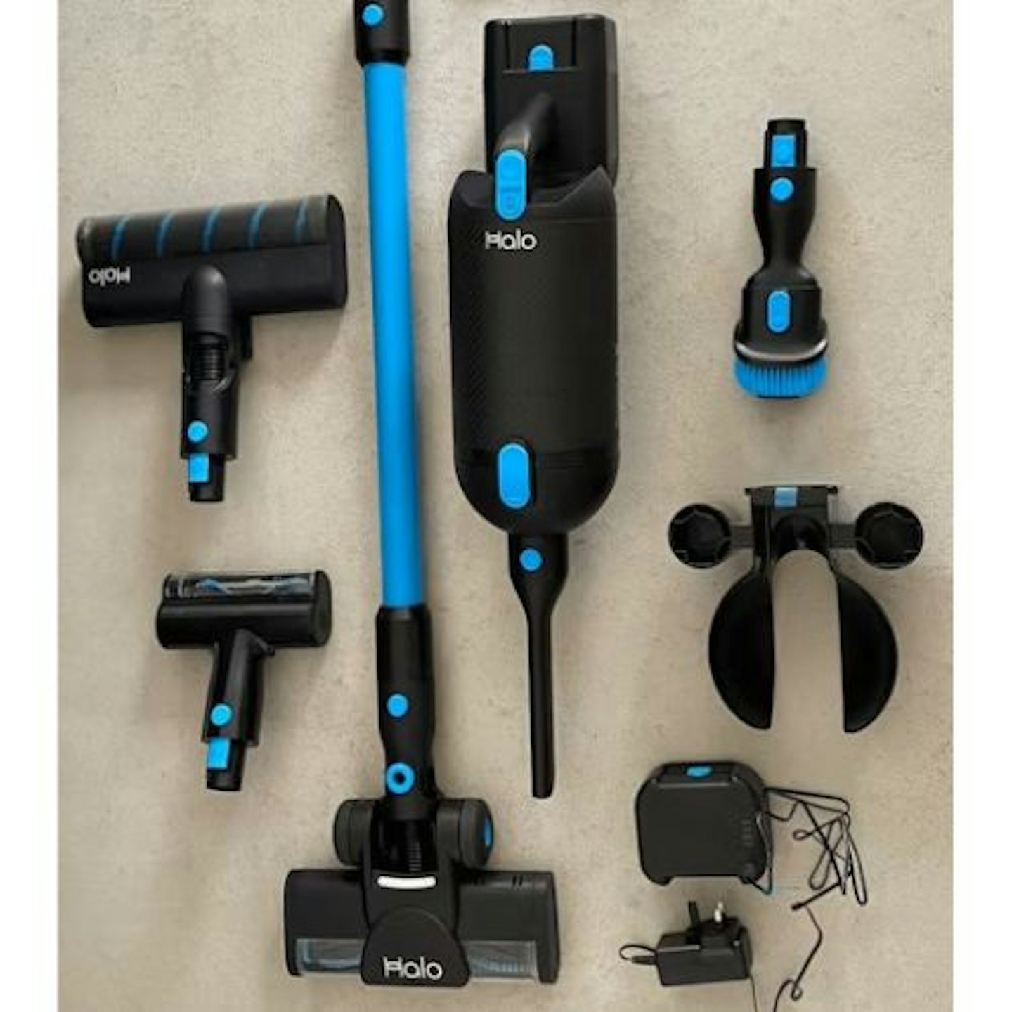 photo of the Halo Capsule X Cordless Vacuum laid out in its component parts on a carpet