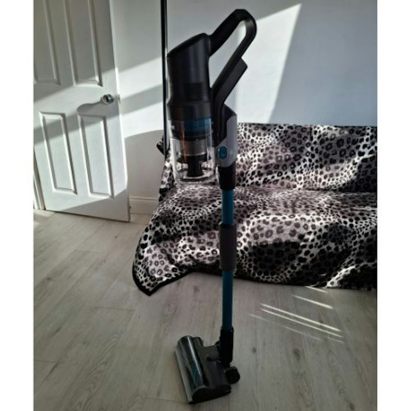 Side view of the self-standing VAX HomePro Pet Design Cordless Vacuum Cleaner on a hard floor