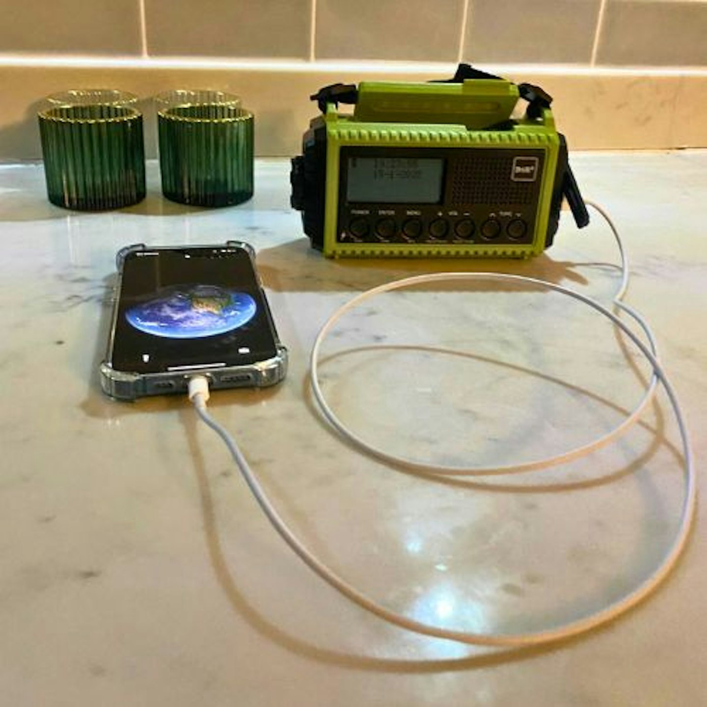 Portable DAB/FM Radio with Rechargeable Battery charging a phone