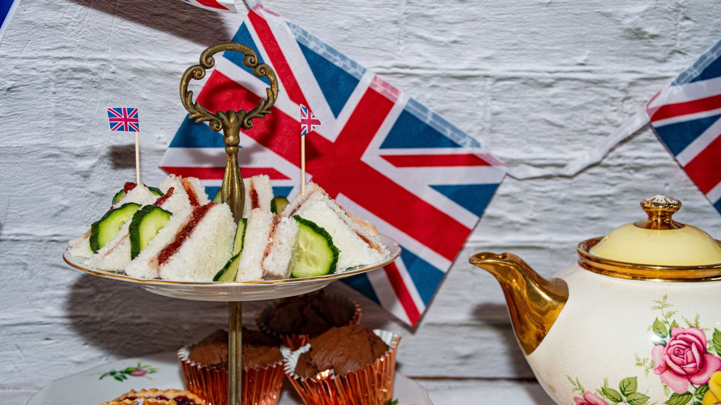 Platinum jubilee celebration tea party food with union jack flags - stock photo