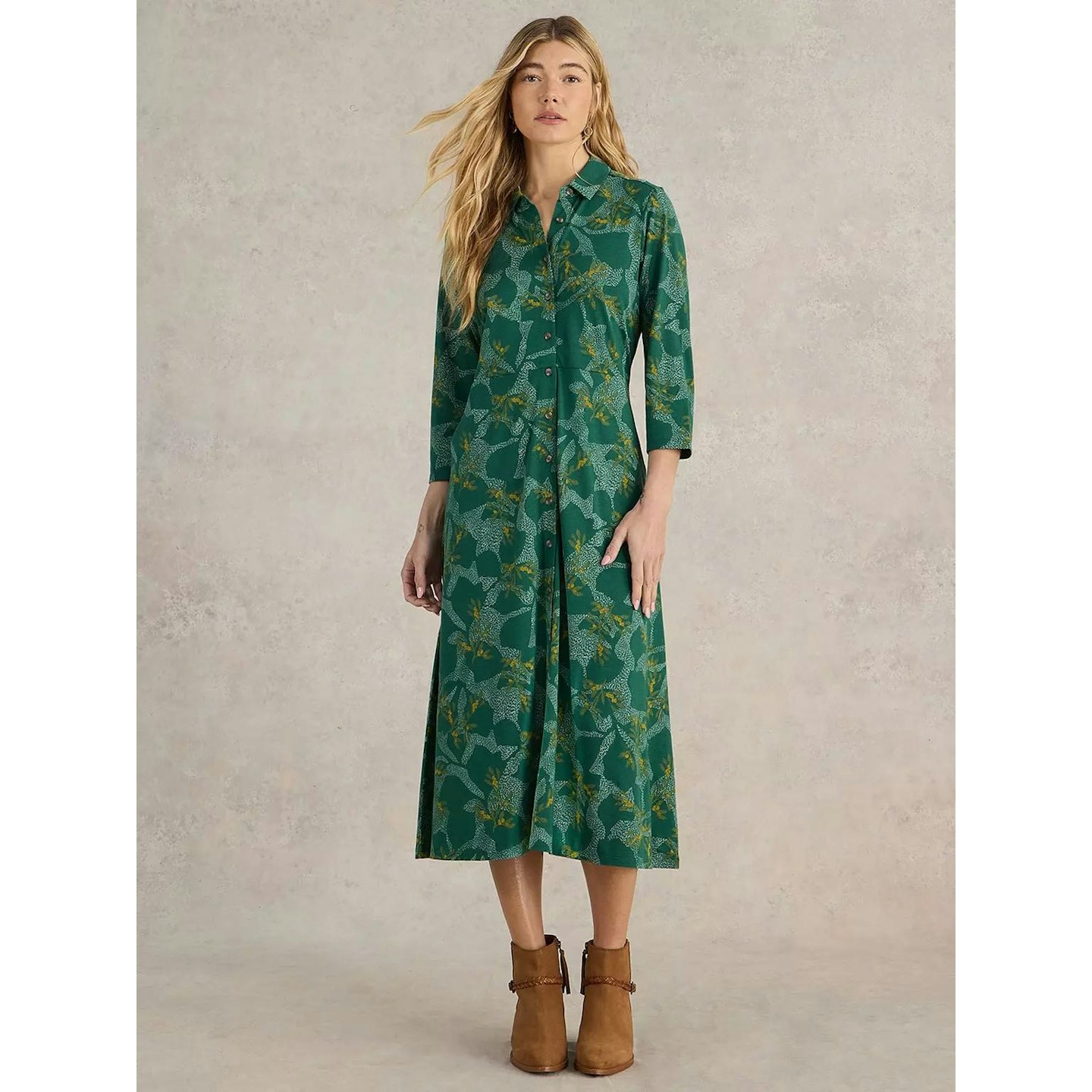 Green shirt dress with blue floral print on female model 