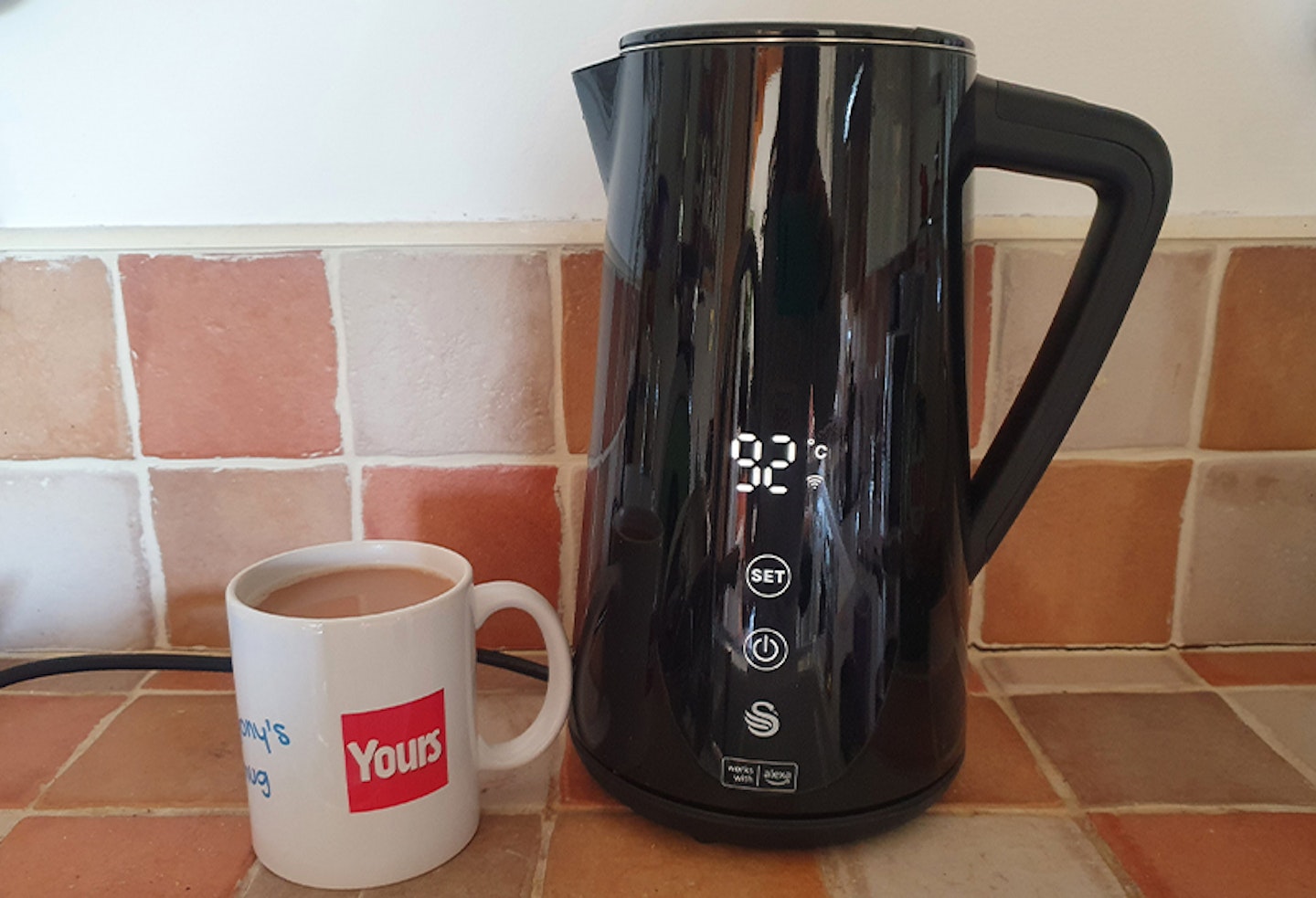 Yours tests the Swan Alexa kettle with a mug of tea in a Yours branded mug