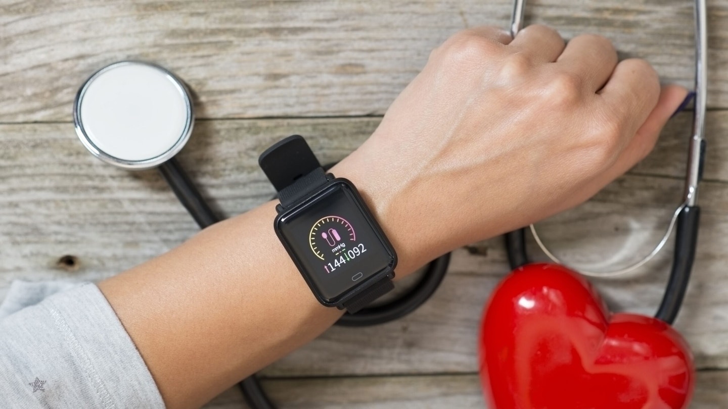 Person monitoring their blood pressure on a watch