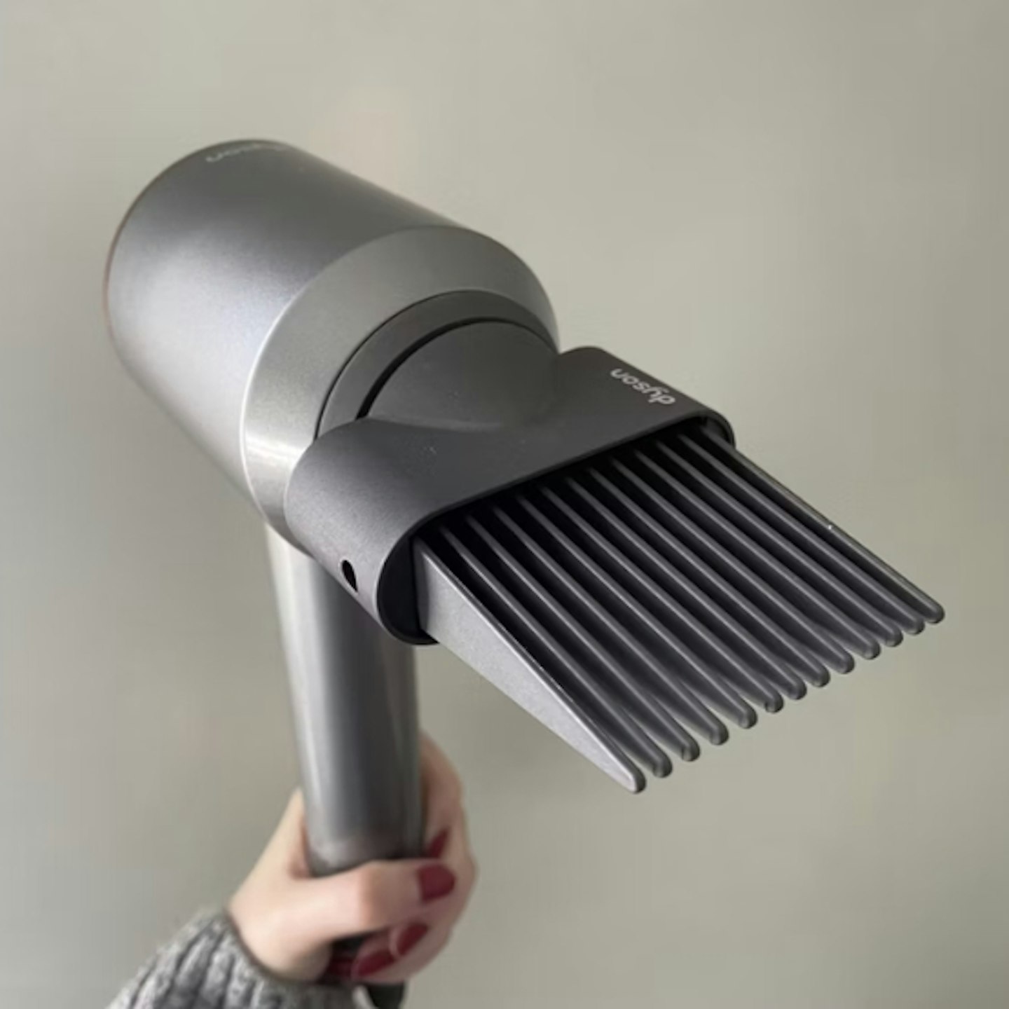 wide-tooth comb on the Dyson Supersonic™ Hair Dryer Nickel/Copper