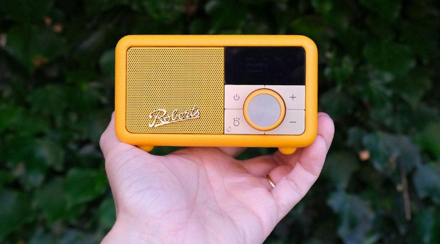 Roberts Revival Petite DAB radio being held by reviewer. Best overall portable radio. 