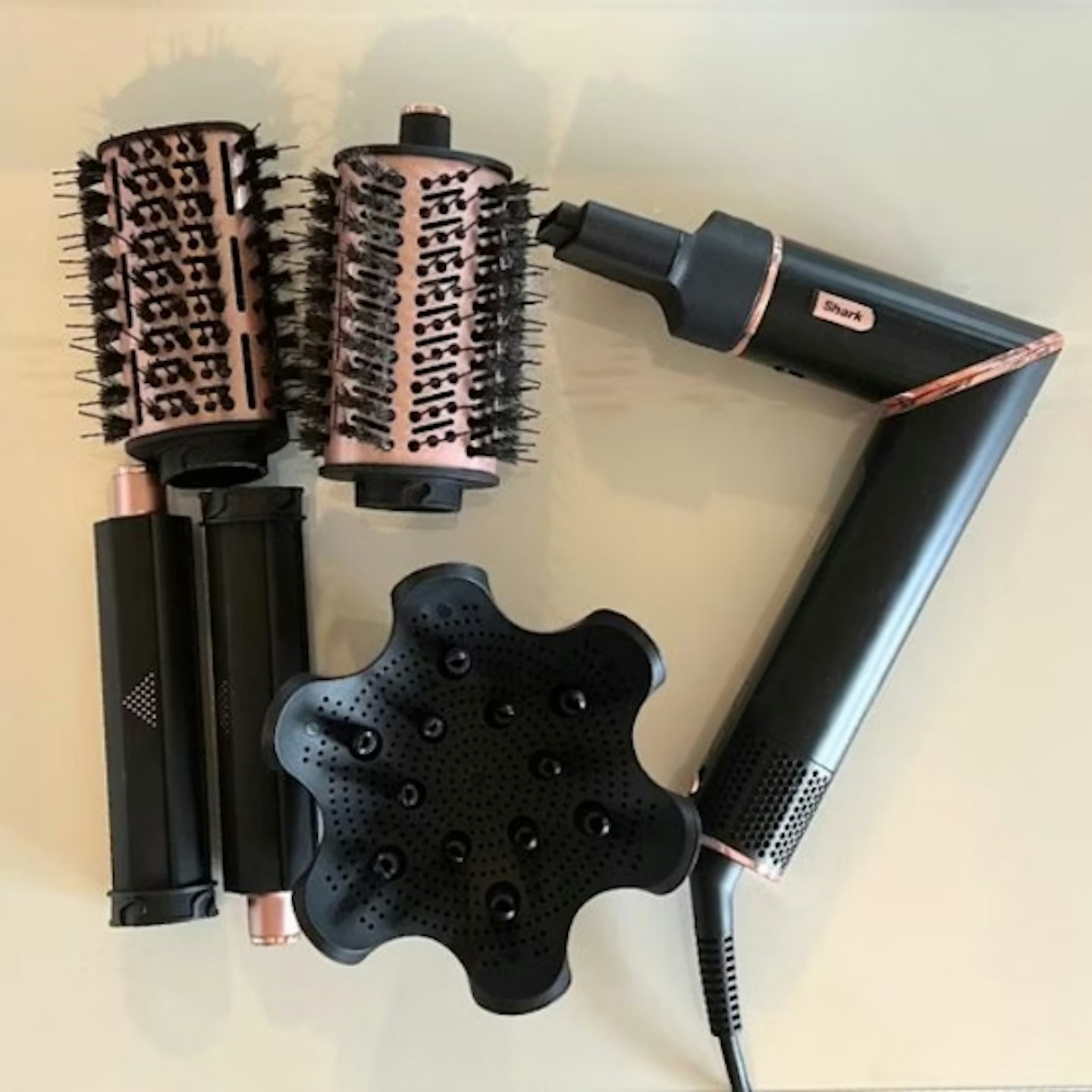 attachments laid out next to the Shark FlexStyle 5-in-1 Air Styler and Hair Dryer