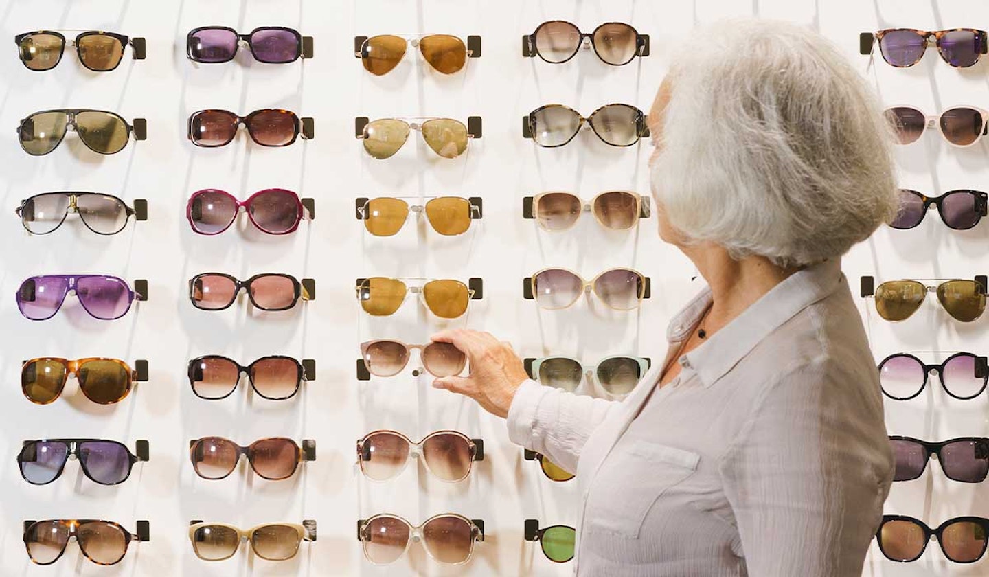 Woman shopping for polarised sunglasses