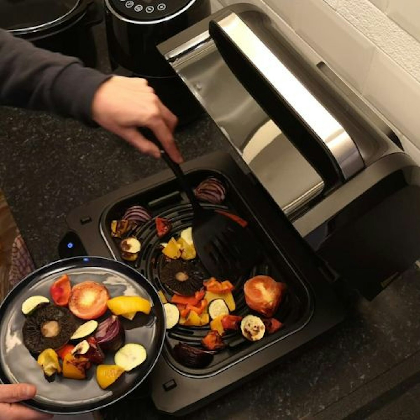 Tester serving roasted Mediterranean vegetables from the Salter Aerogrill