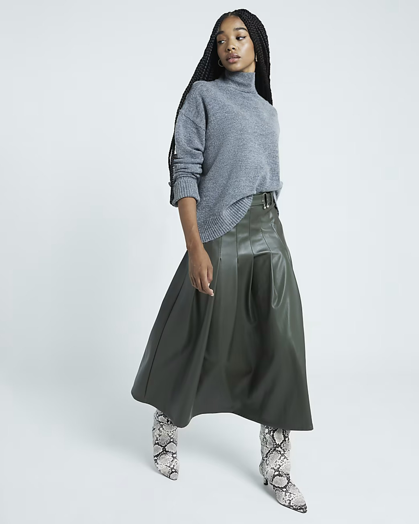 Model wearing the River Island Green Faux Leather Pleated Midi Skirt