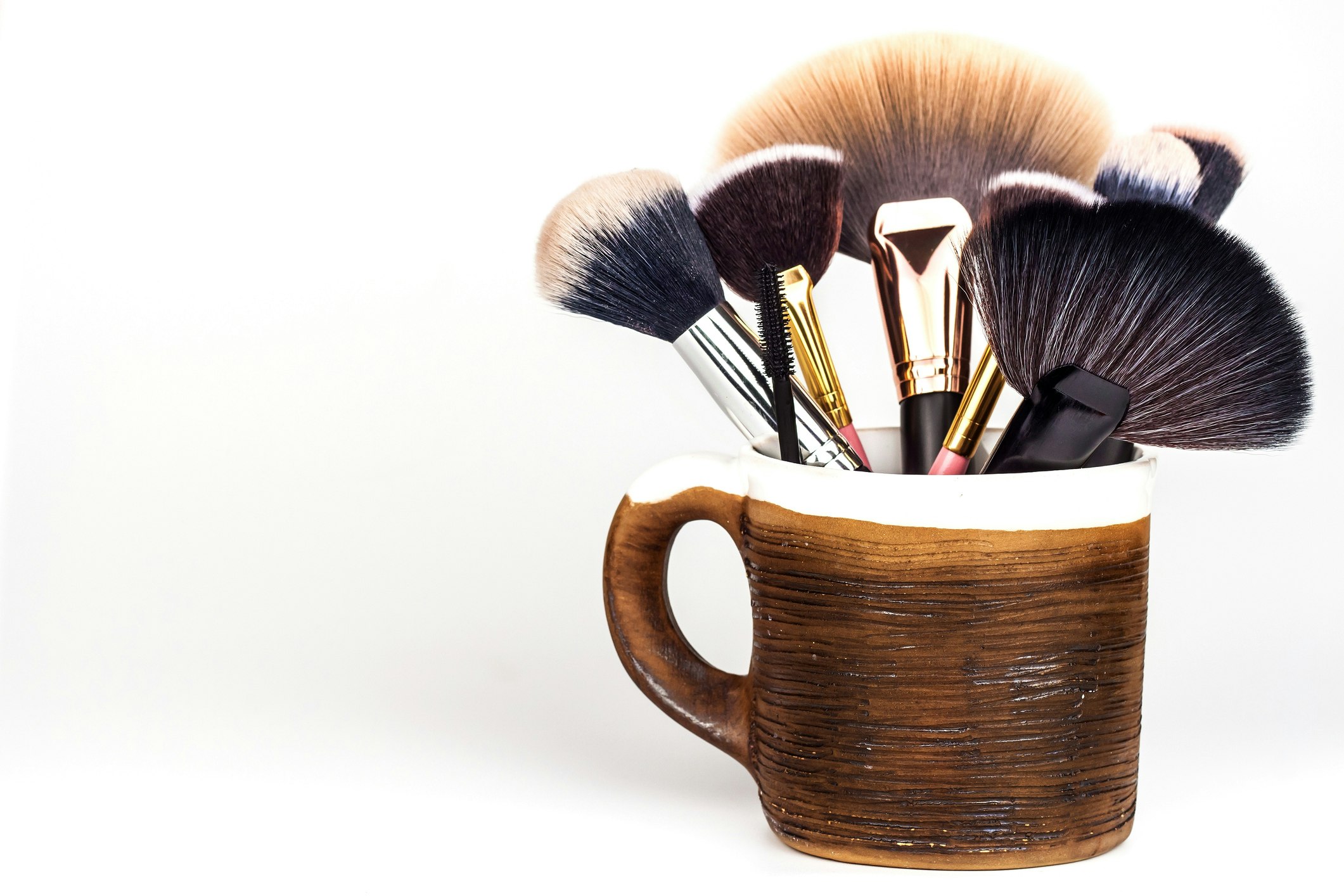 coffee mug holding makeup brushes