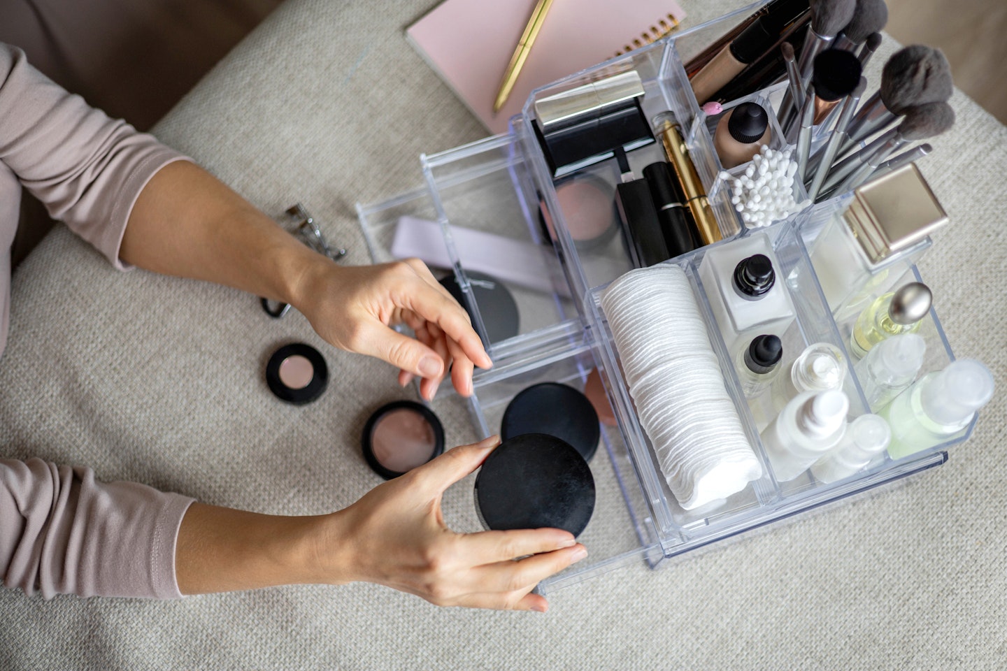 woman organising makeup