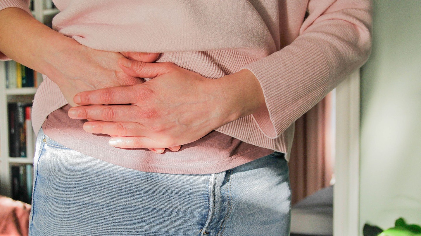 Woman holding her stomach