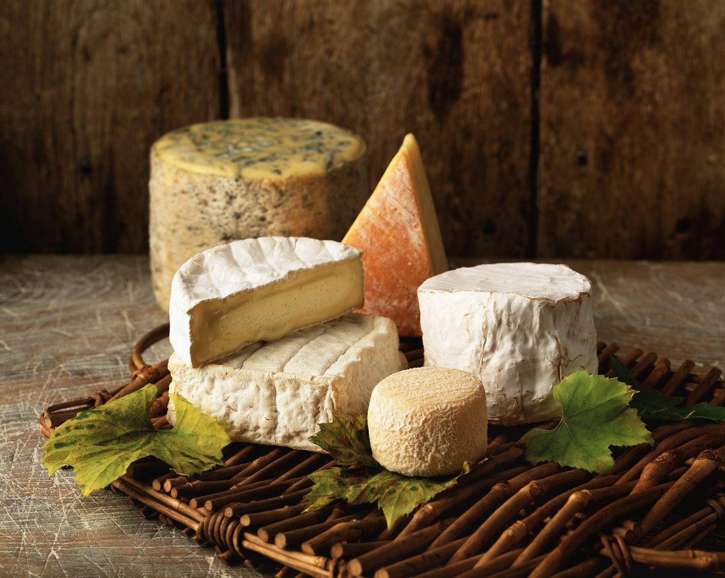 Variety of cheese on a wicker tray