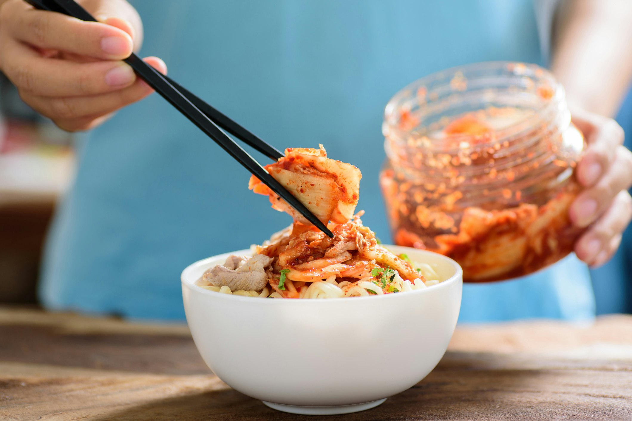 Kimchi served with a bowl of noodles