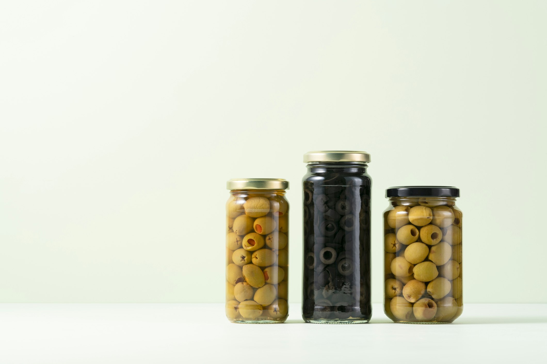 A Variety of Olives Sealed and Preserved in Glass Jars