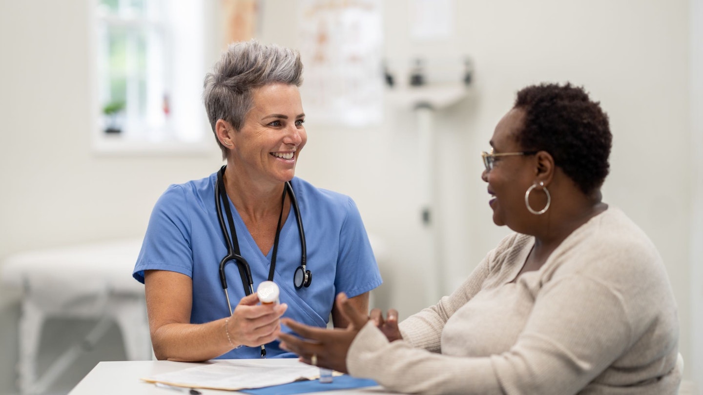 female patient talking to female doctor