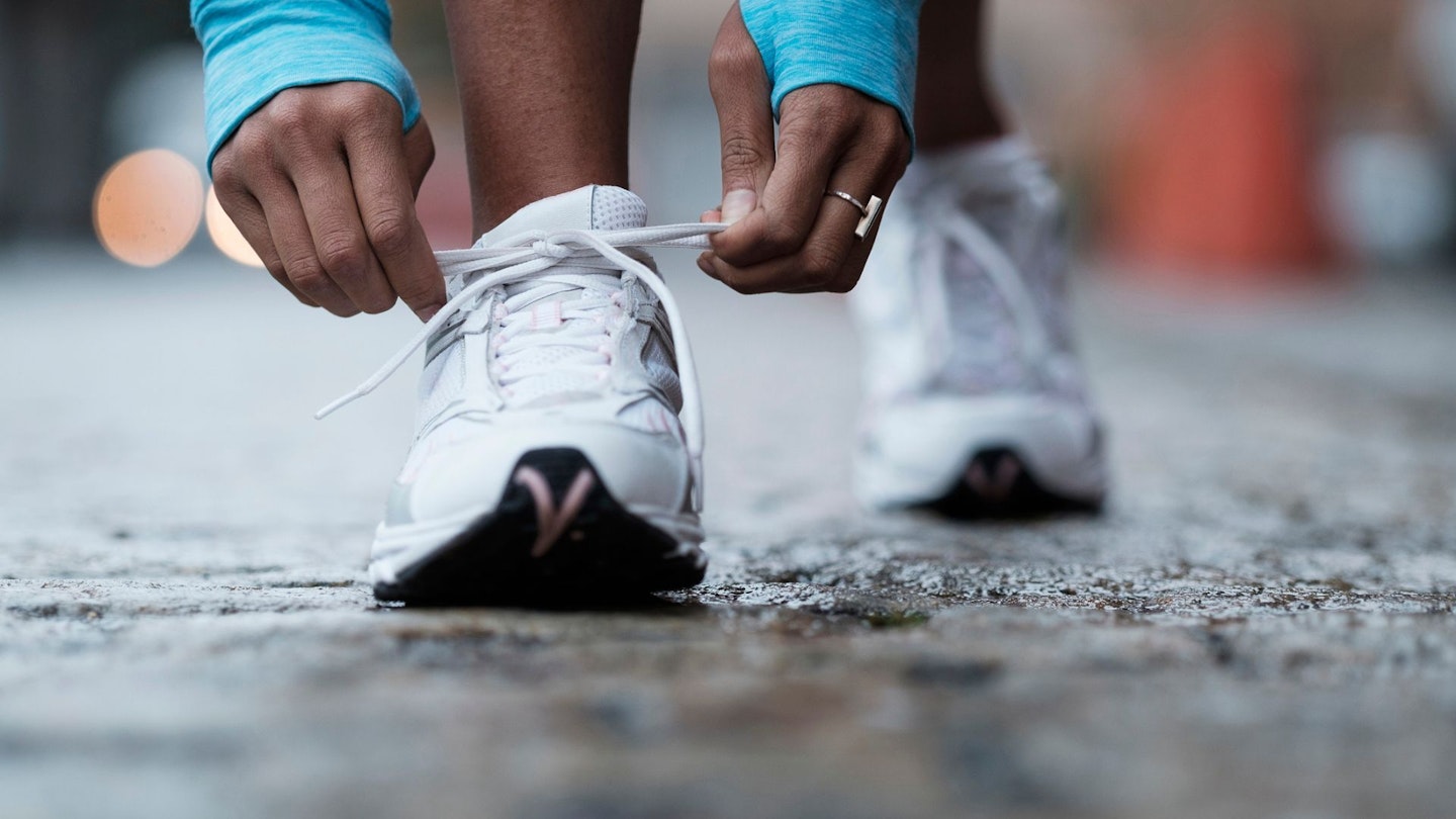 Runner tying shoelaces