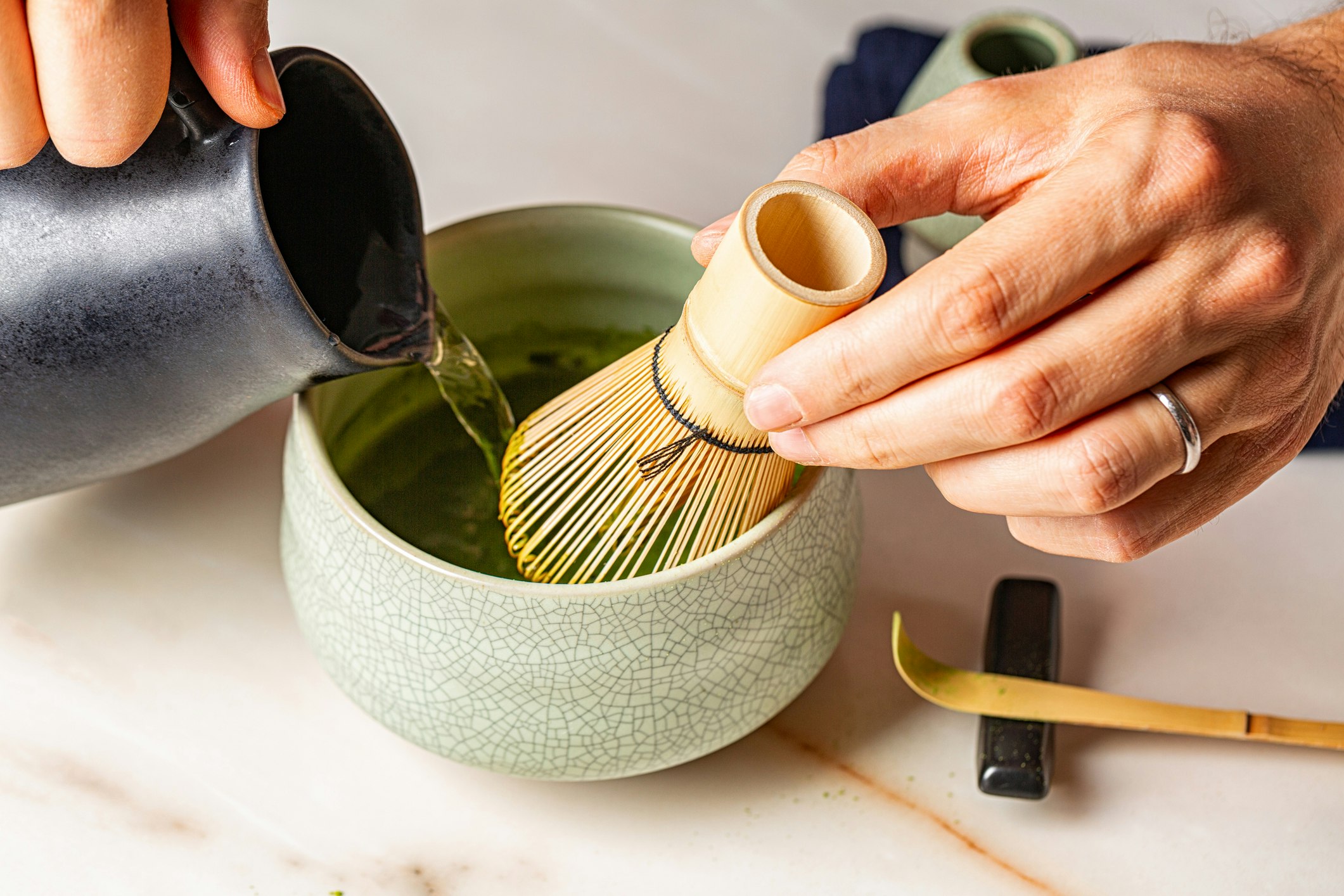 Man hands, Cooking green matcha tea
