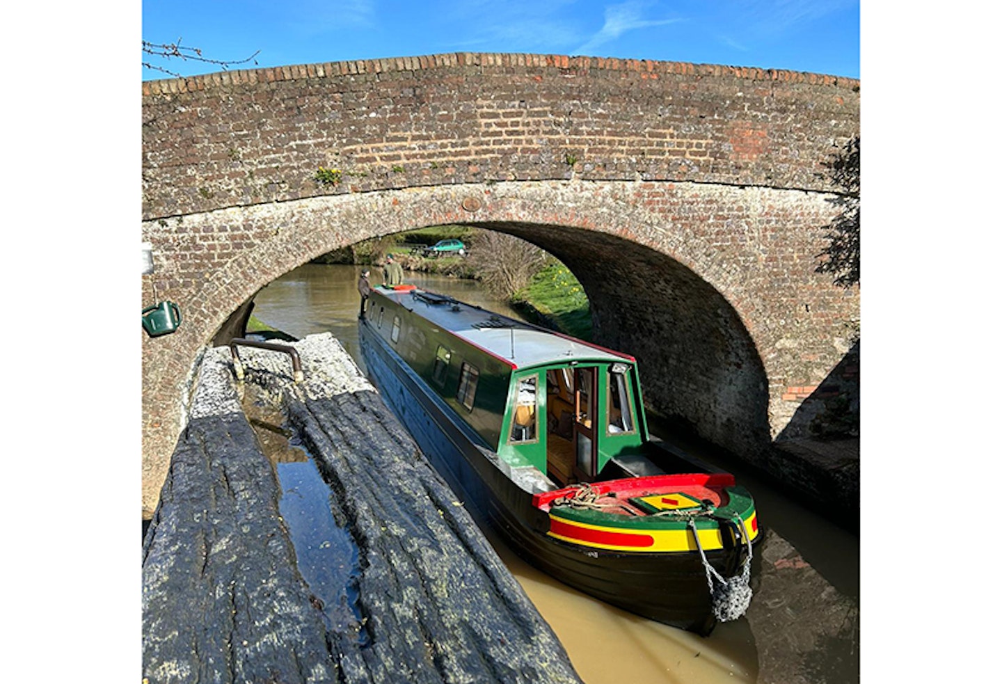 traveling under a bridge on canal