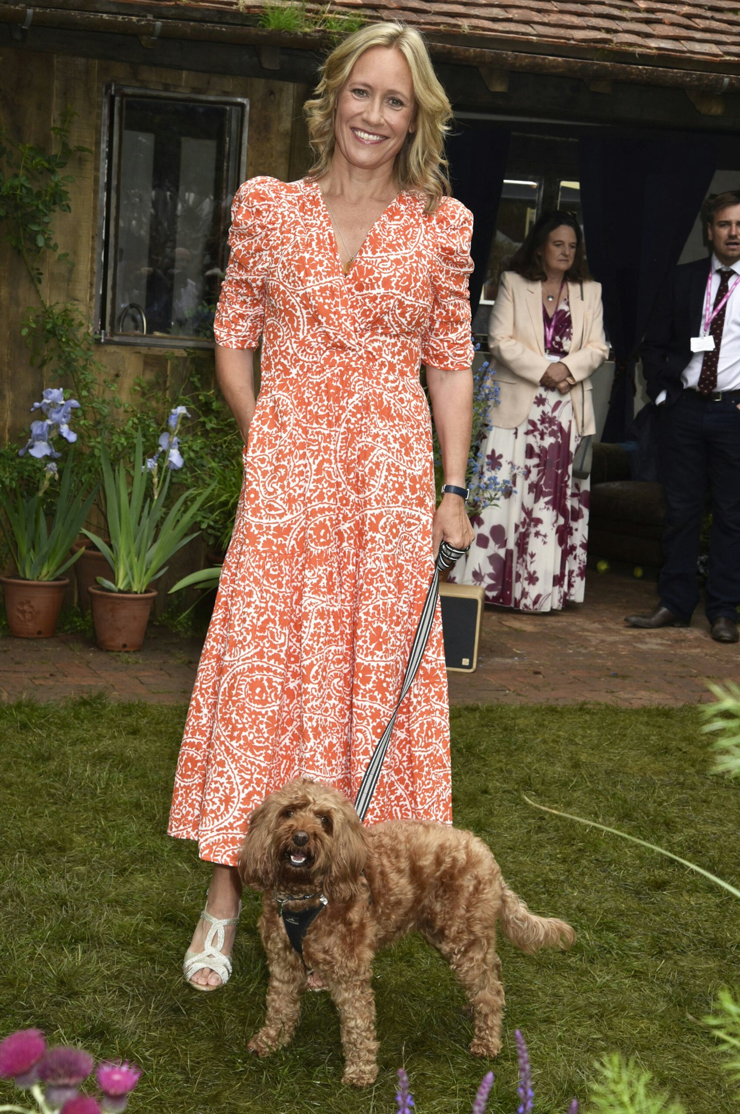 Sophie Raworth is an orange paisley dress at The RHS Flower Show 2025